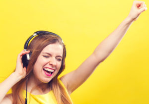 Happy young woman with headphones